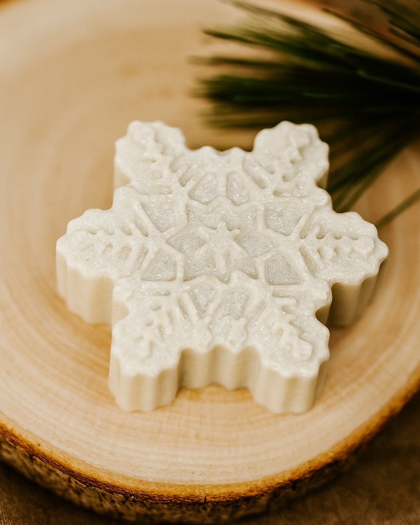 White Arctic Snowflake soap by DEOS Co., inspired by winter purity and Greek botanicals, blending lime and cinnamon in a clean, minimal, and luxurious Christmas design.