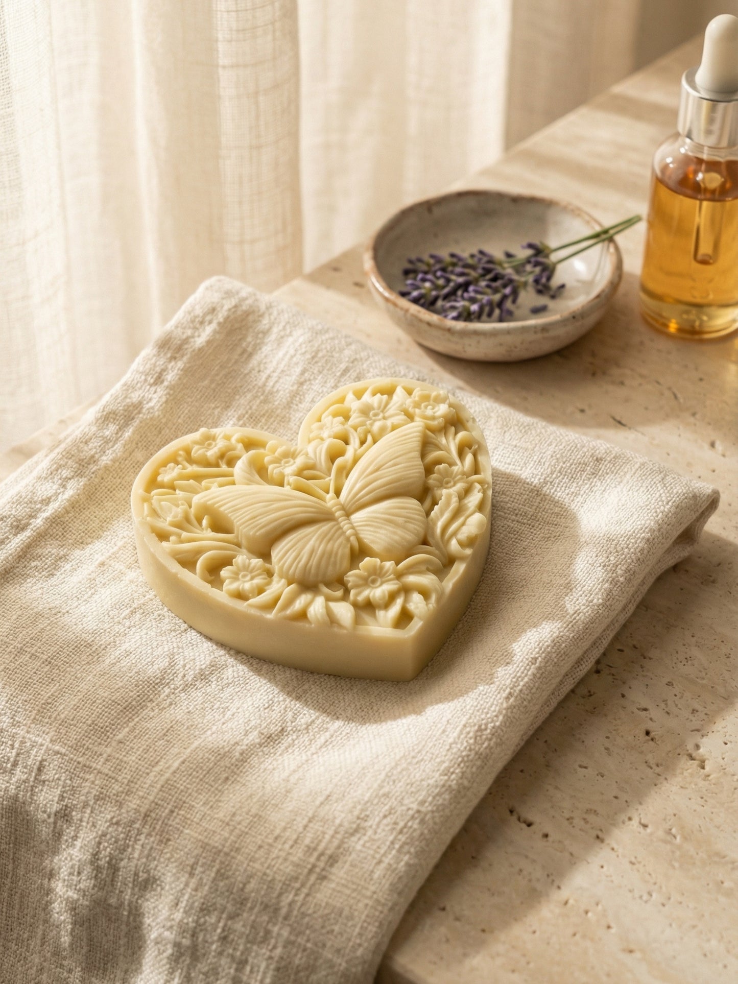 KARDIÁ butterfly heart lavender olive oil soap by DEOS CO. on linen with botanical elements
