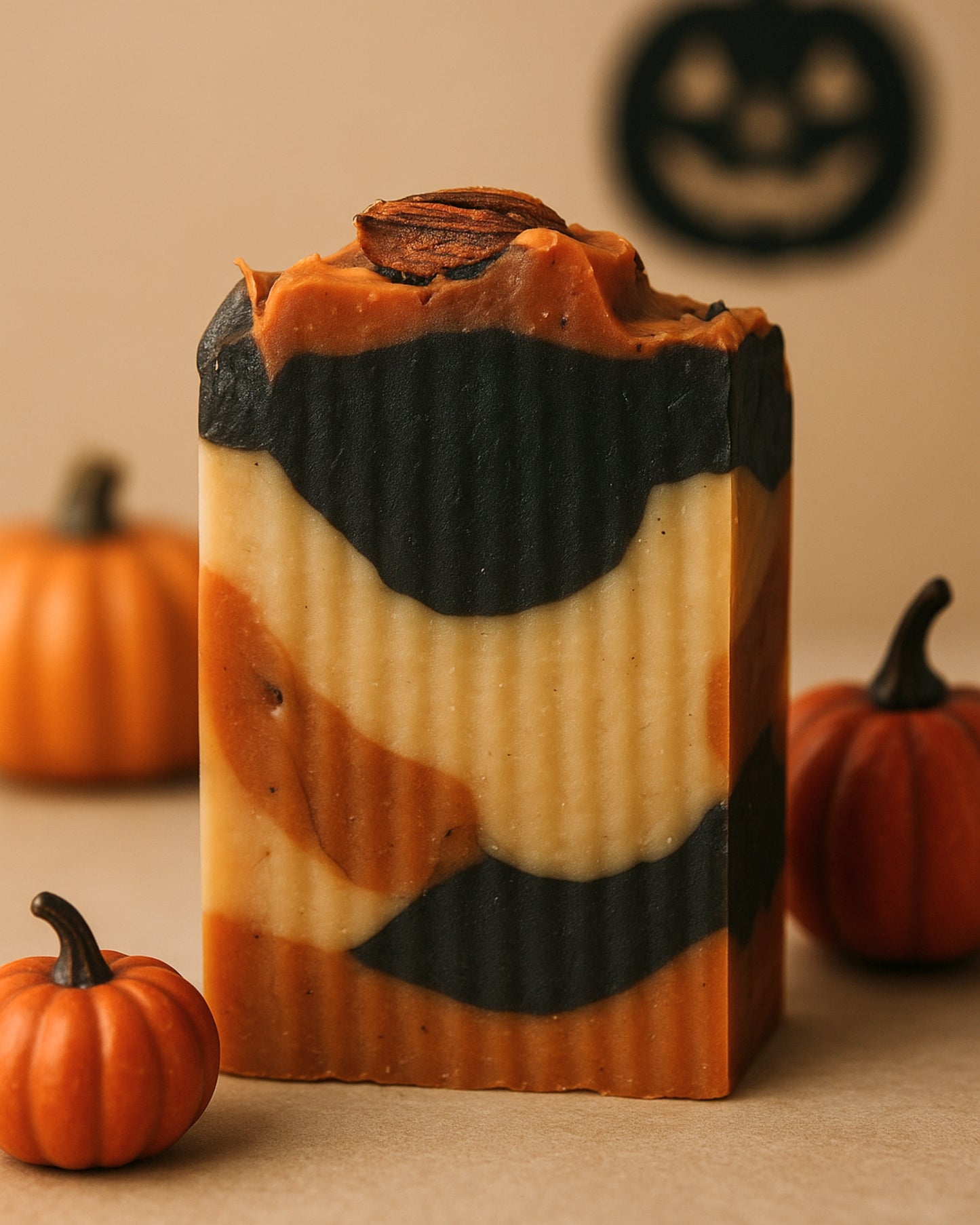 Halloween-themed soap bar with pumpkins in the background