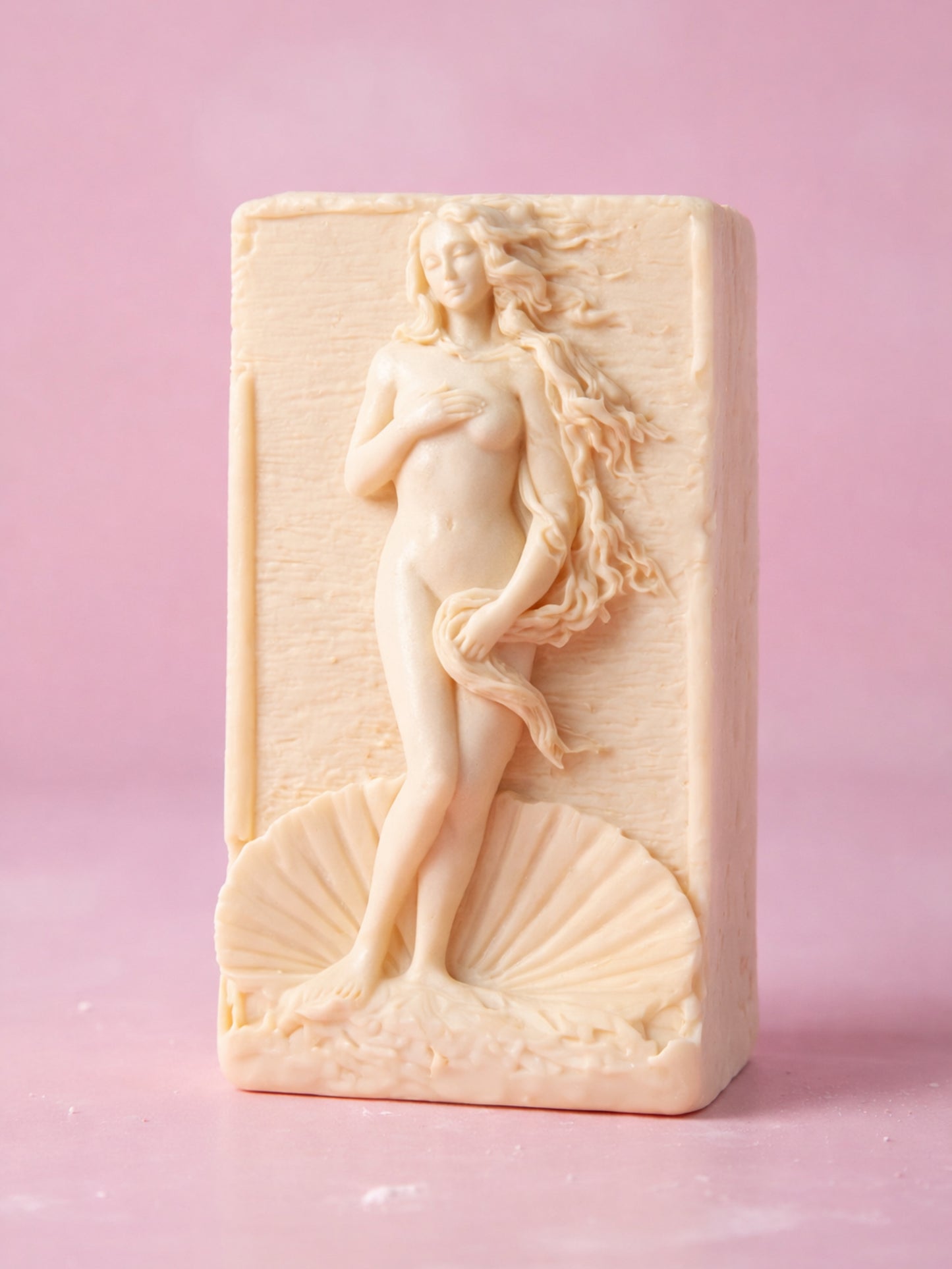  rectangular olive oil soap featuring Aphrodite relief, showing size and sculptural detail, natural lavender soap by DEOS Co on a pink background