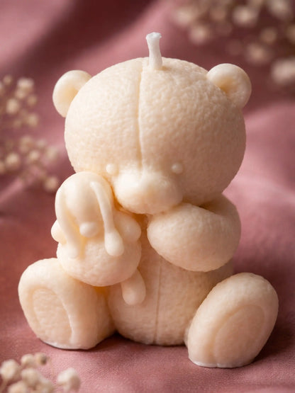Elior Vanilla soy teddy bear candle holding a bunny, handmade Valentine’s Day gift candle in soft cream wax by DEOS CO