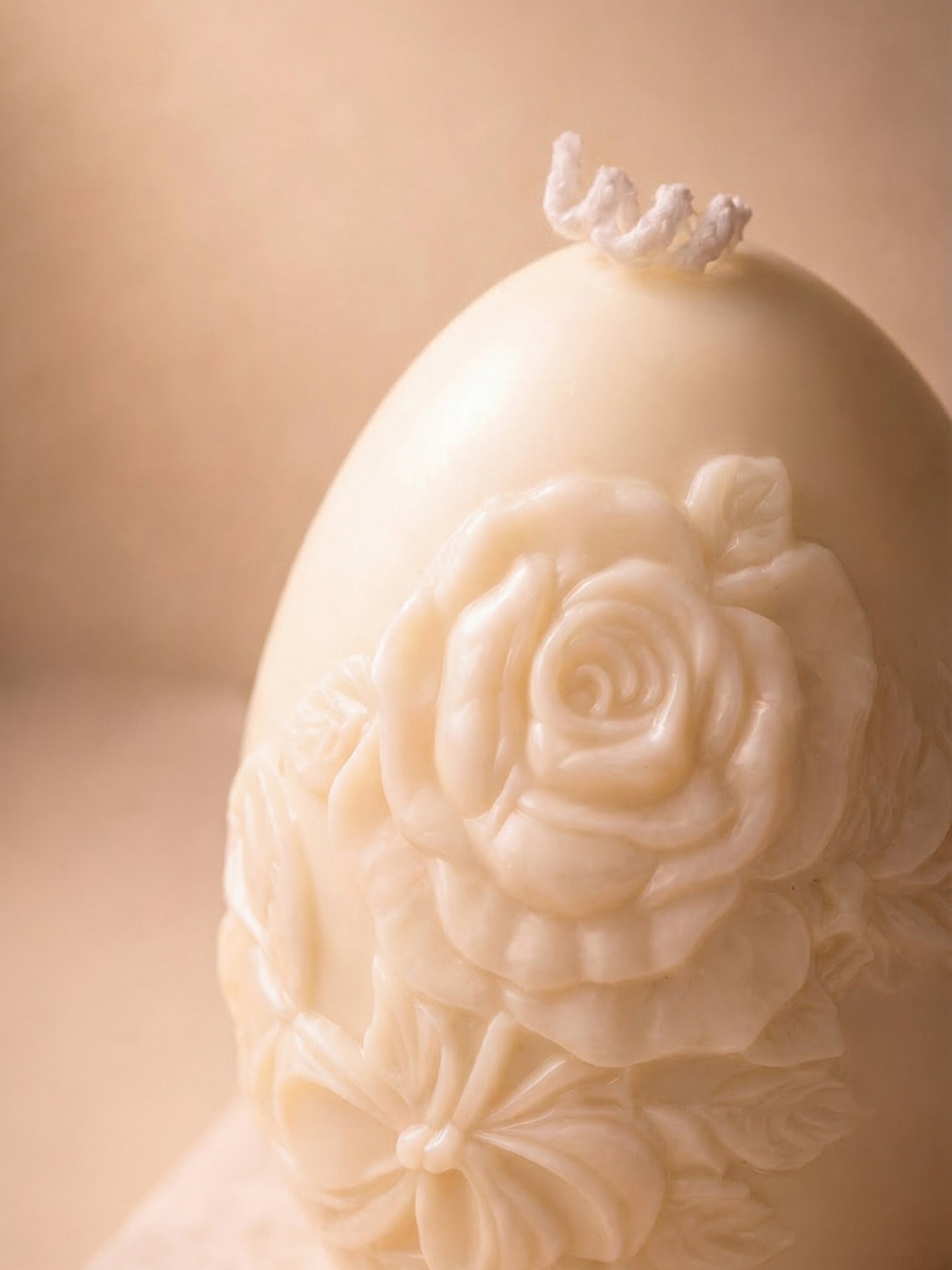 Close-up of floral sculptural Easter egg candle, Nectar of Elysium luxury honey vanilla soy wax candle detail
