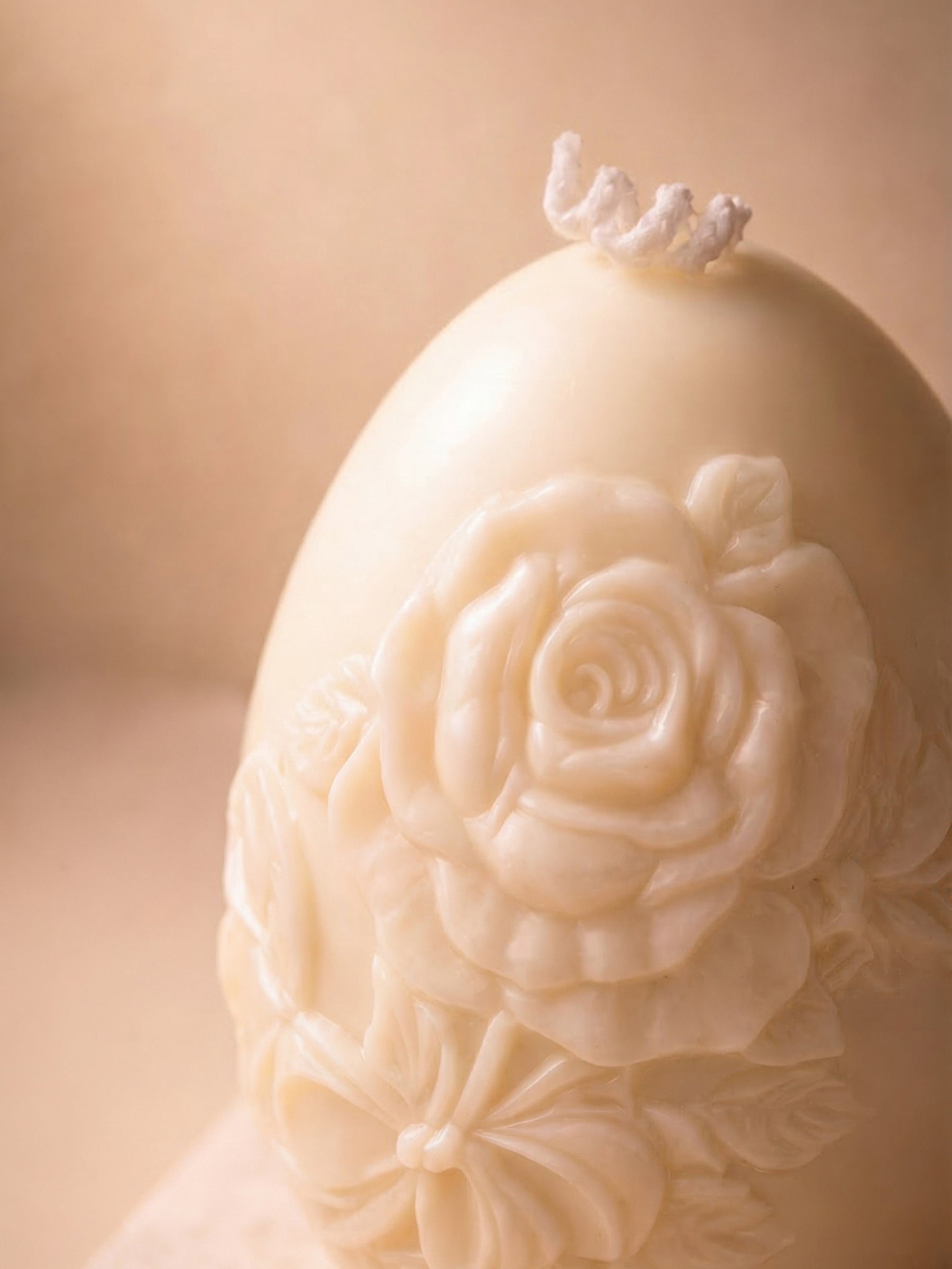 Close-up of floral sculptural Easter egg candle, Nectar of Elysium luxury honey vanilla soy wax candle detail