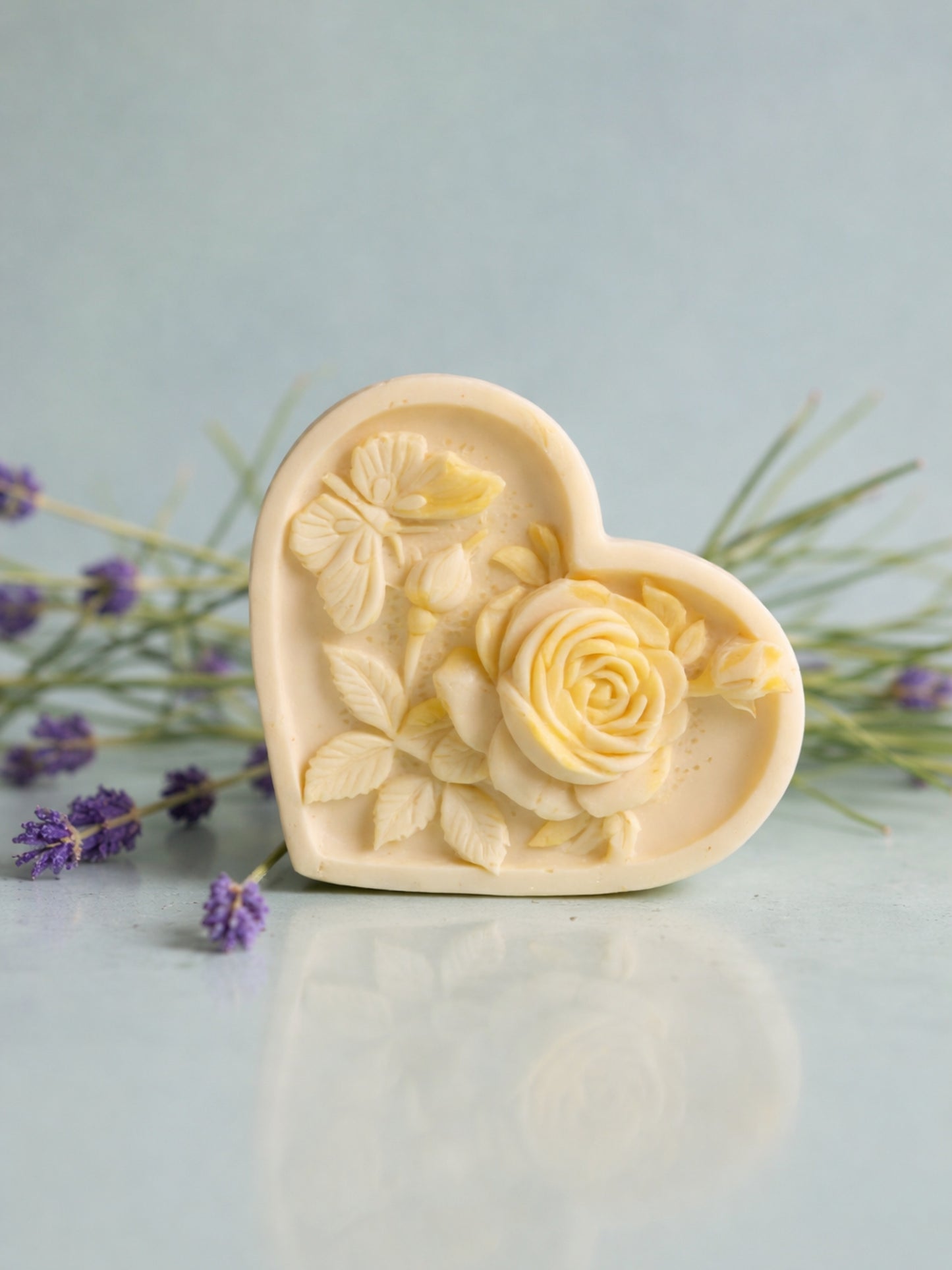 Heart-shaped floral soap with lavender flowers on a light blue background by DEOS CO. Nardus Bliss Soap Collection The Heart Soap
