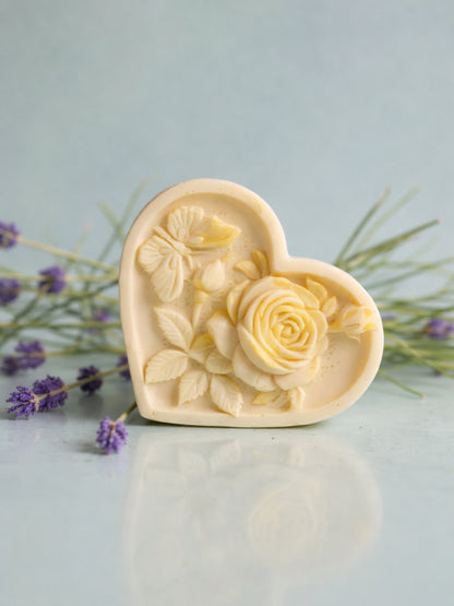 Heart-shaped floral soap with lavender flowers on a light blue background by DEOS CO. Nardus Bliss Soap Collection The Heart Soap
