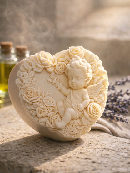 Heart-shaped soap with angel and floral design on a textured surface with greek olive oil bottles and lavender in the background by DEOSCO

The Eros Angel — Pure Olive Oil & Lavender Soap | Nardus Bliss Collection