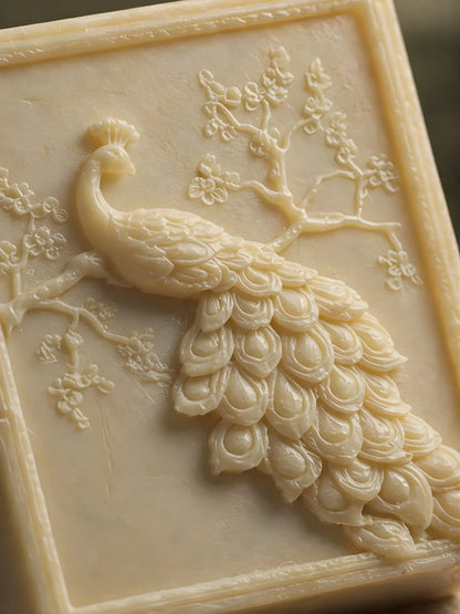 Close-up of peacock carved olive oil jasmine soap, handcrafted botanical relief, premium natural skincare by DEOS Co.