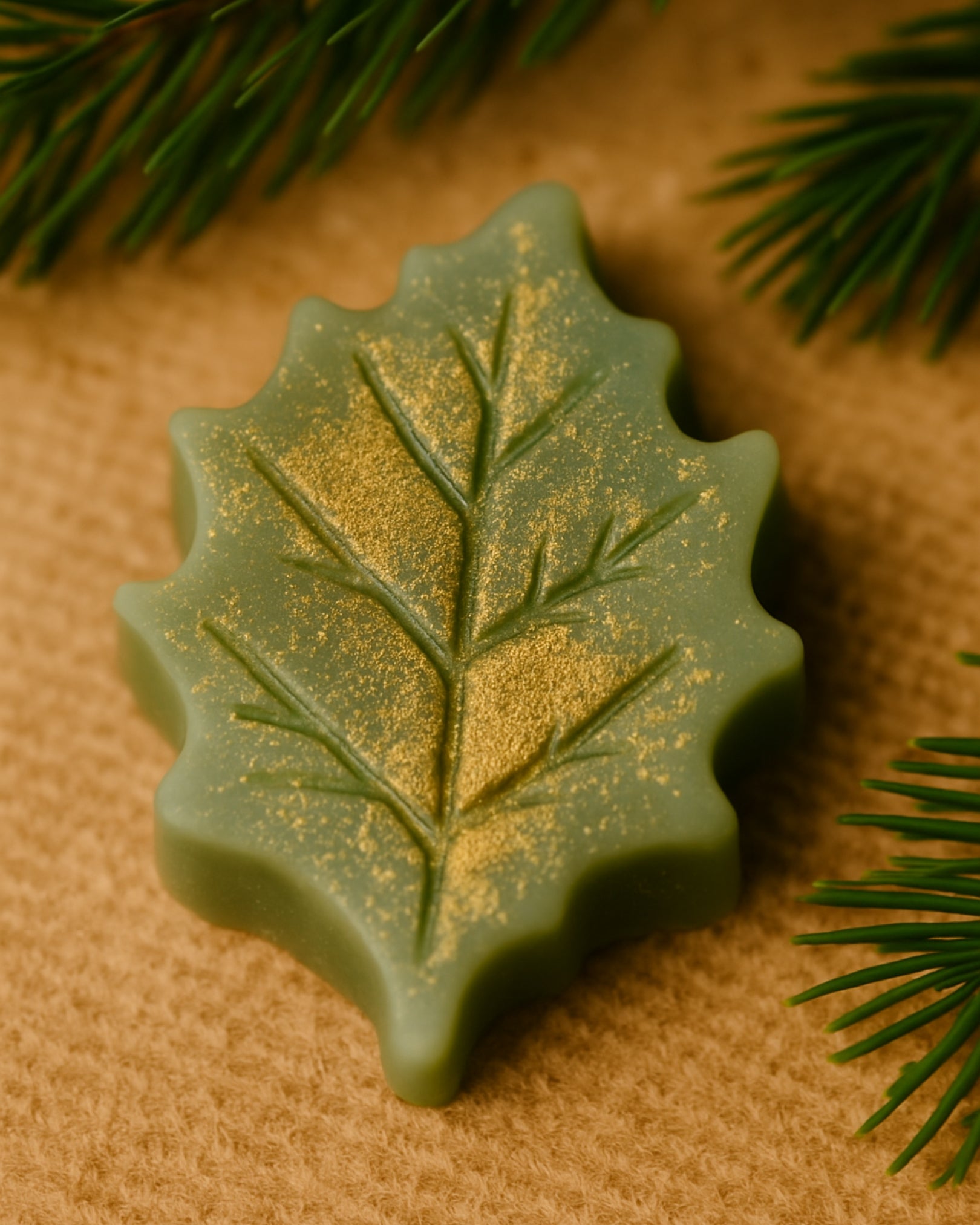 Luxurious Elysian Leaf handmade Christmas soap with gold shimmer — infused with pure pine and orange essential oils, inspired by ancient Greek botanicals for a naturally elegant skincare experience.