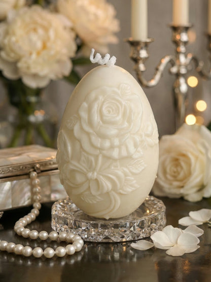 Nectar of Elysium Easter egg candle in elegant setting, luxury honey vanilla soy wax sculptural candle with floral detailing and pearls
