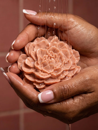 PEONÍA by DEOS Co. – Valentine’s Day flower soap with rose geranium and vanilla, sculpted peony design held in dark colour feminine hands with french manicure.