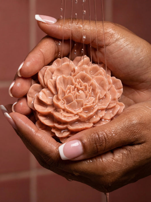 PEONÍA by DEOS Co. – Valentine’s Day flower soap with rose geranium and vanilla, sculpted peony design held in dark colour feminine hands with french manicure.