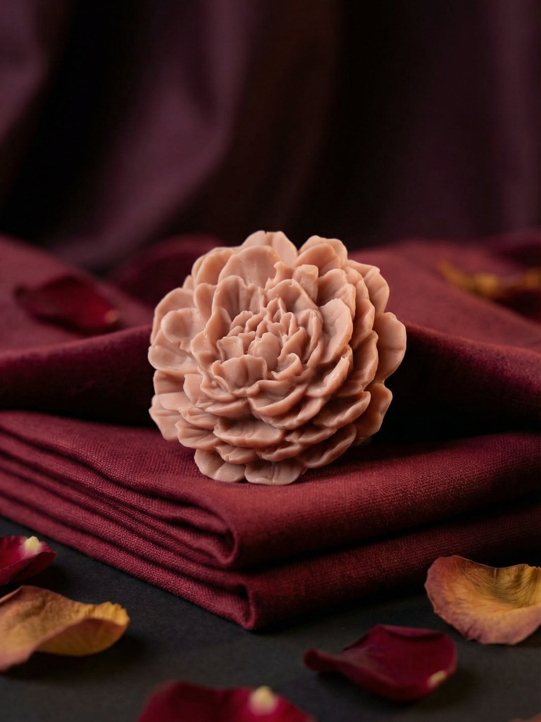 PEONÍA – sculpted peony flower soap by DEOS Co., rose geranium and vanilla Valentine’s Day Collection on deep red fabric.
