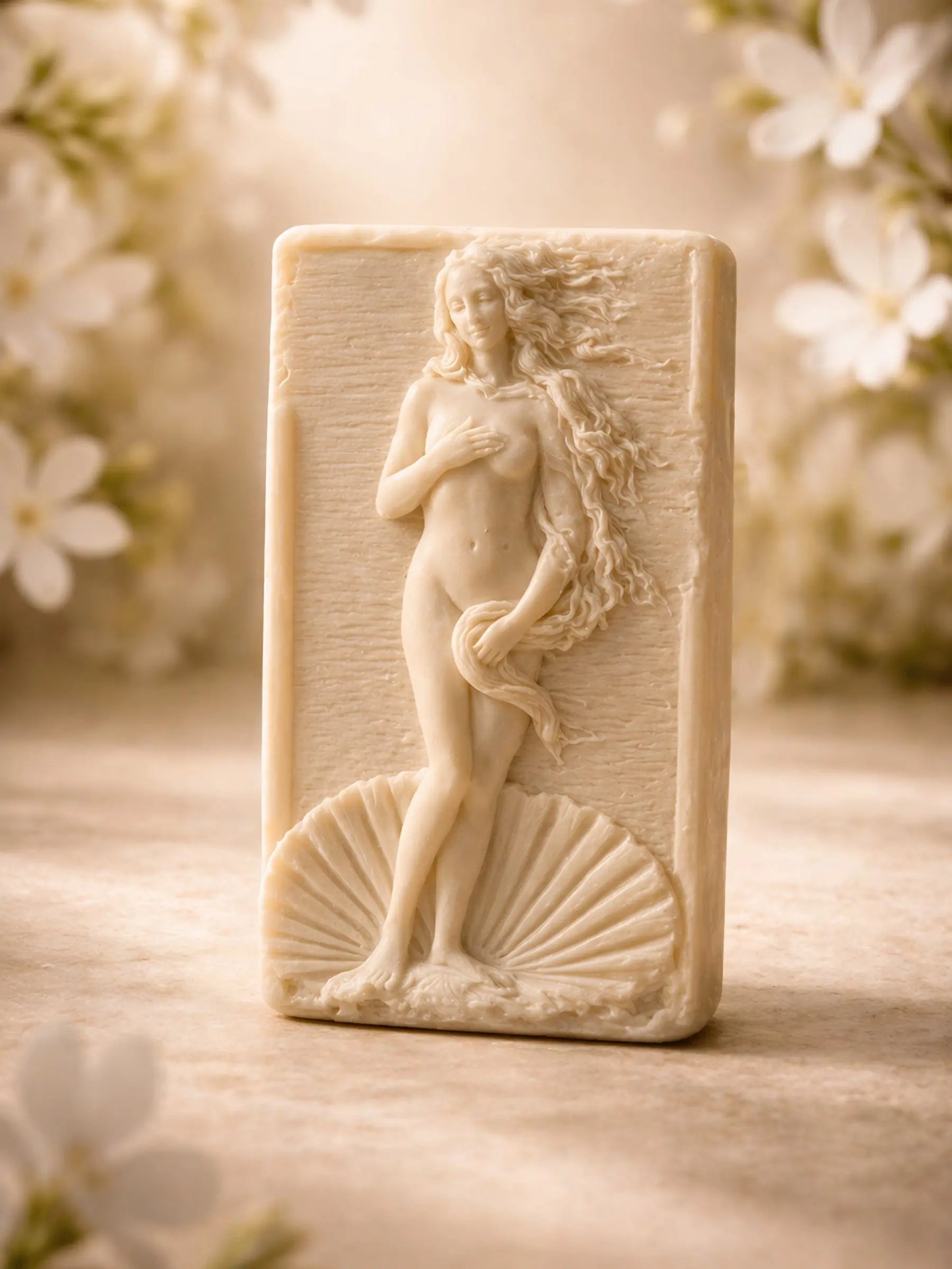 Anadyomene Aphrodite jasmine olive oil soap in warm editorial lighting, premium handmade soap by DEOS Co.