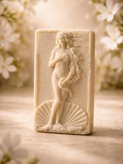Anadyomene Aphrodite jasmine olive oil soap in warm editorial lighting, premium handmade soap by DEOS Co.