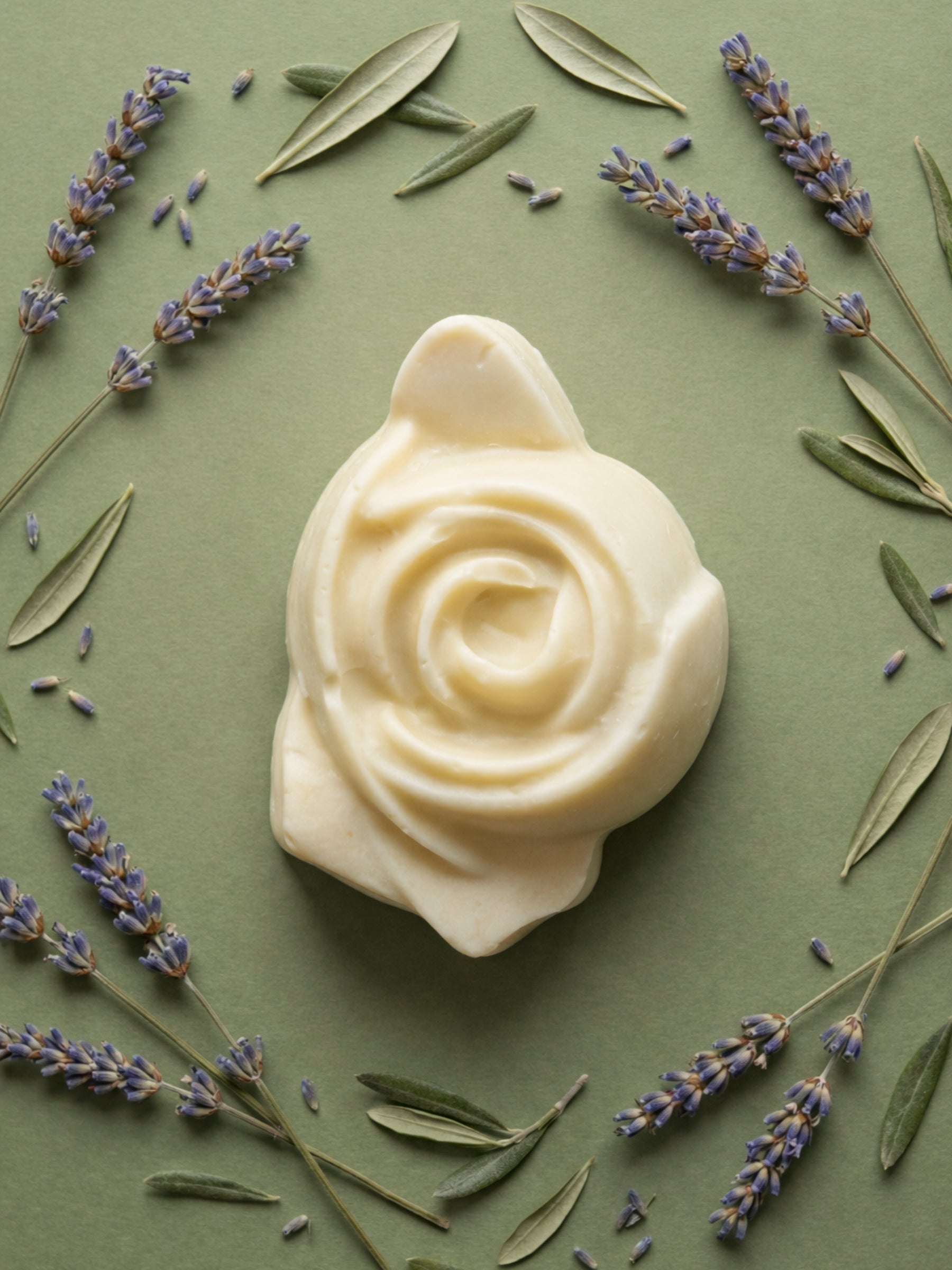 The Anthéa by DEOS CO., an ivory rose-shaped bar soap made from pure olive oil, surrounded by lavender