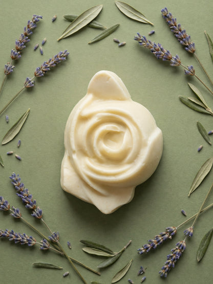 The Anthéa by DEOS CO., an ivory rose-shaped bar soap made from pure olive oil, surrounded by lavender