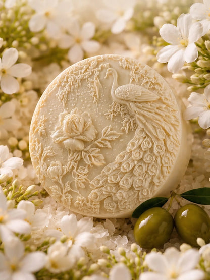 Peacock olive oil jasmine soap surrounded by white jasmine flowers and green olives, premium natural soap DEOS Co.