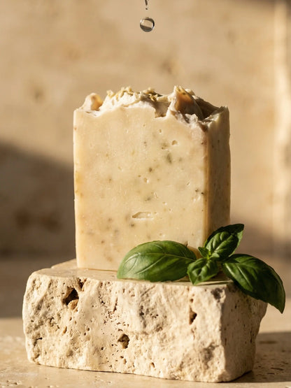 Handmade basil olive oil soap bar close up, natural exfoliating skincare with botanical ingredients for soft radiant skin
