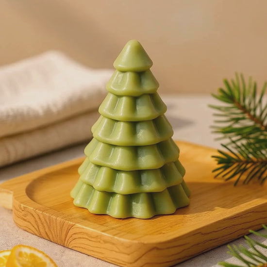 Close-up of DEOS Co. Olympian Pine handmade soap — a luxury Christmas tree design with pine and orange essential oils, French green clay, and golden shimmer, made in Greece.