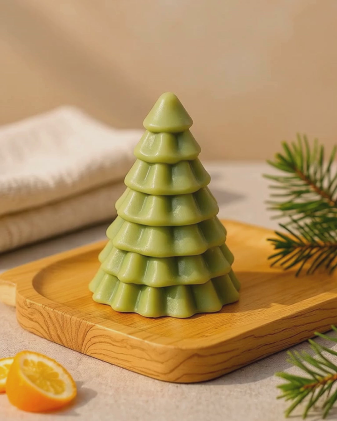 Close-up of DEOS Co. Olympian Pine handmade soap — a luxury Christmas tree design with pine and orange essential oils, French green clay, and golden shimmer, made in Greece.
