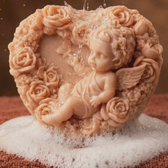 Eros Angel sculpted heart soap under running water, highlighting natural texture and romantic Valentine’s Day mood.